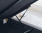 Cove upholstered bed frame with a lift mechanism in a room with white tiles.