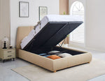 Beige upholstered bed with open storage compartment in a bedroom setting