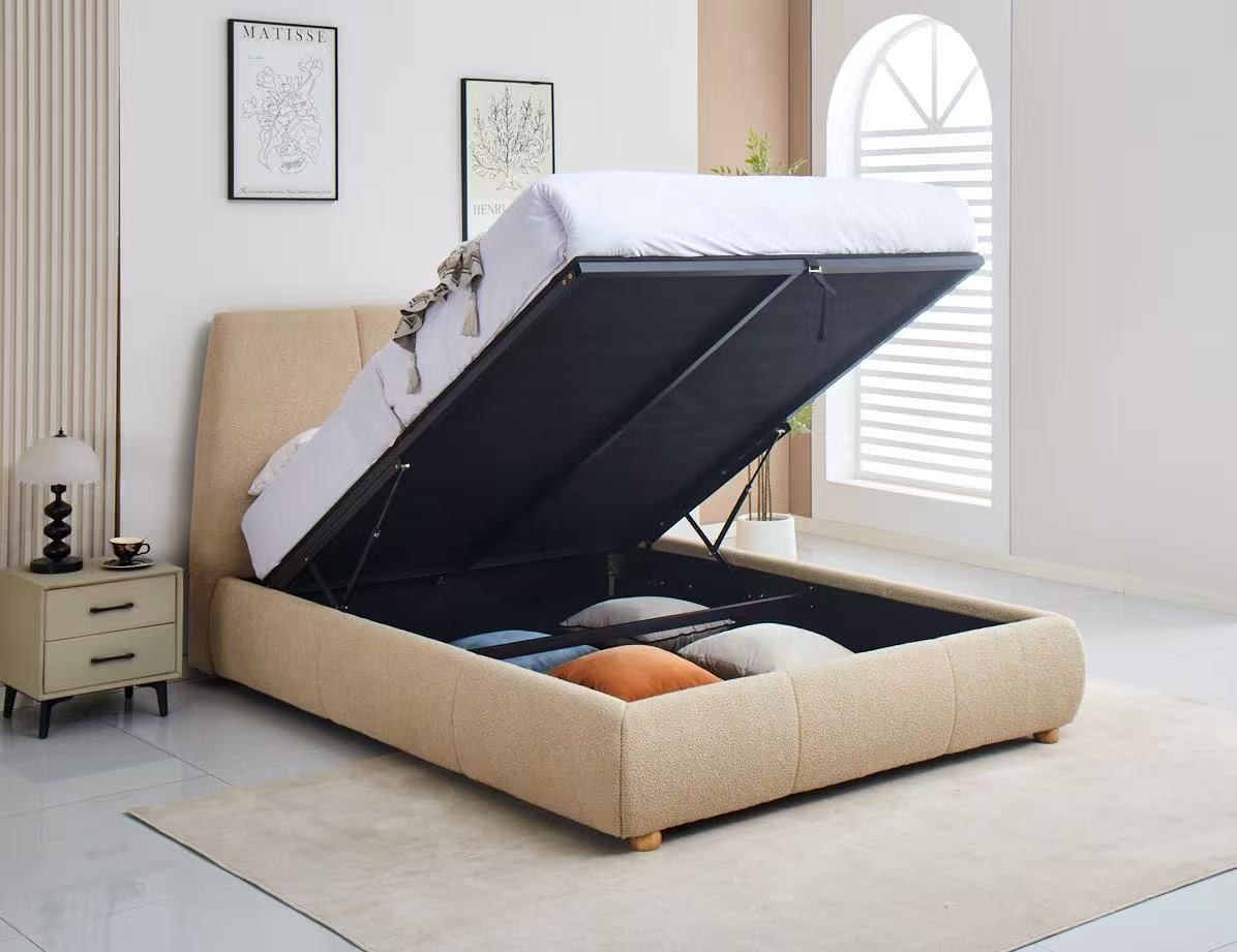 Beige upholstered bed with open storage compartment in a bedroom setting